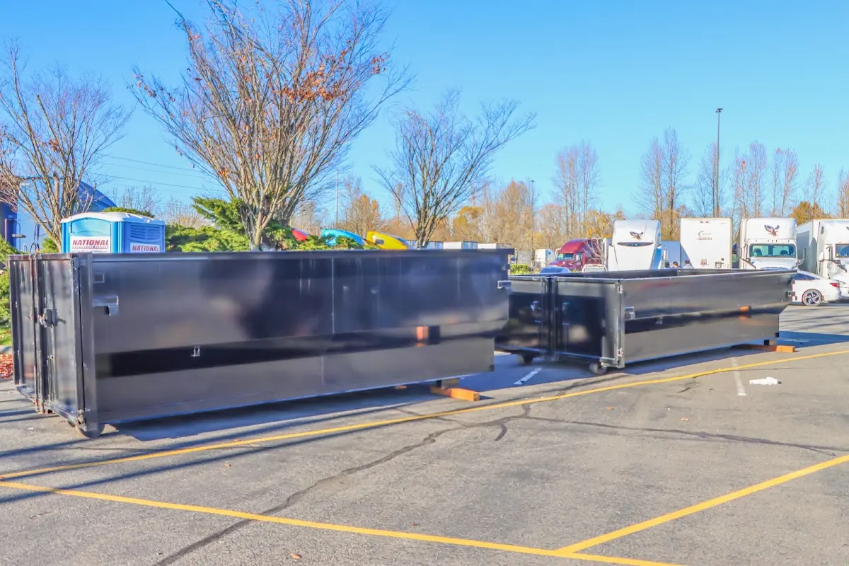 Professional dumpster rental service with roll-off container on residential driveway in Floral City